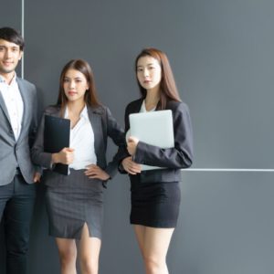 Portrait of Asian creative business team. on formal suit front of building office